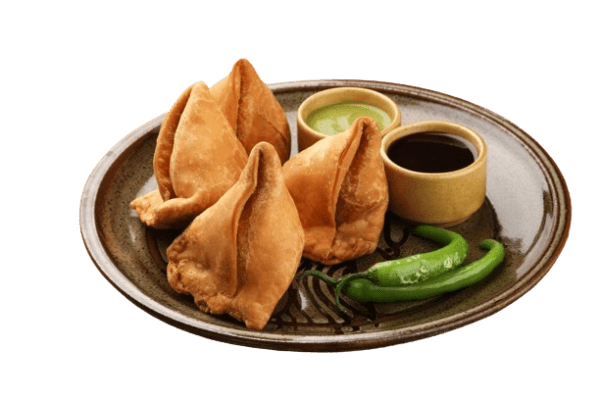 a plate filled with Samosa with green chillies