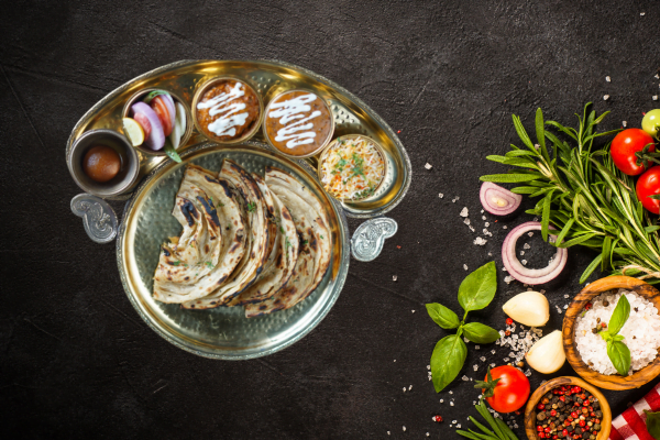 halwaivala paratha thali with multiple side dishes