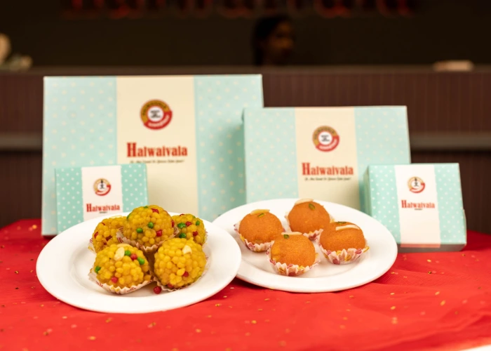 halwaivala festive sweet boxes with colorful boondi ladoos and soft besan ladoos on display