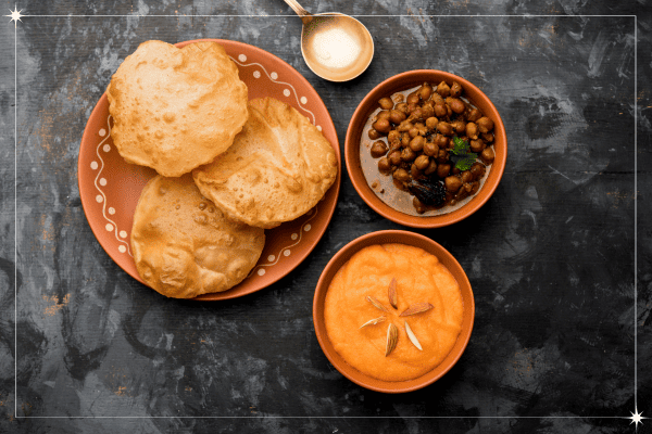 plate filled with halwaivala puri with chana