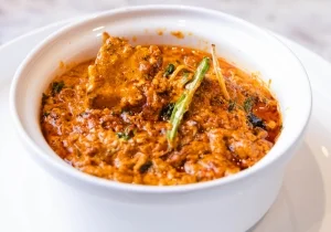 paneer tikka masala served in a white bowl in the best fine dine restaurants in west delhi