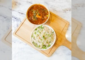 vegetable fried rice with paneer manchurian served on a wooden board in the best fine dine restaurants in west delhi